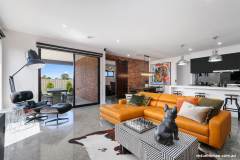 Virtue-Homes-Gallery2021-modern-pop-art-living-room-and-black-kitchen