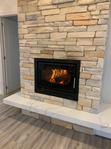 Stone fireplace in Ranch Style home by Virtue Homes