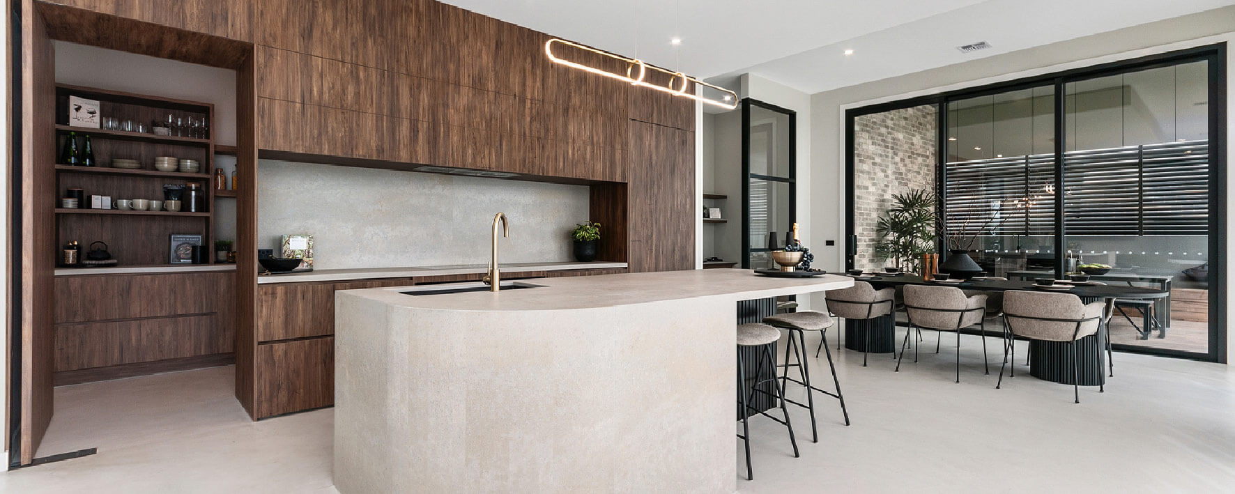 Timber and stone kitchen of Display Home by Virtue Homes