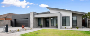 Facade of modern grey home with angle roof
