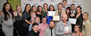 Virtue Homes team members with building awards