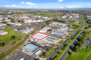 Aerial photo showing the location of storage units with an industrial area, with a red line around the property boundary