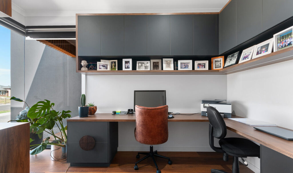Work from Home office space with large windows and timber desk with beautifully crafted modern charcoal coloured cabints